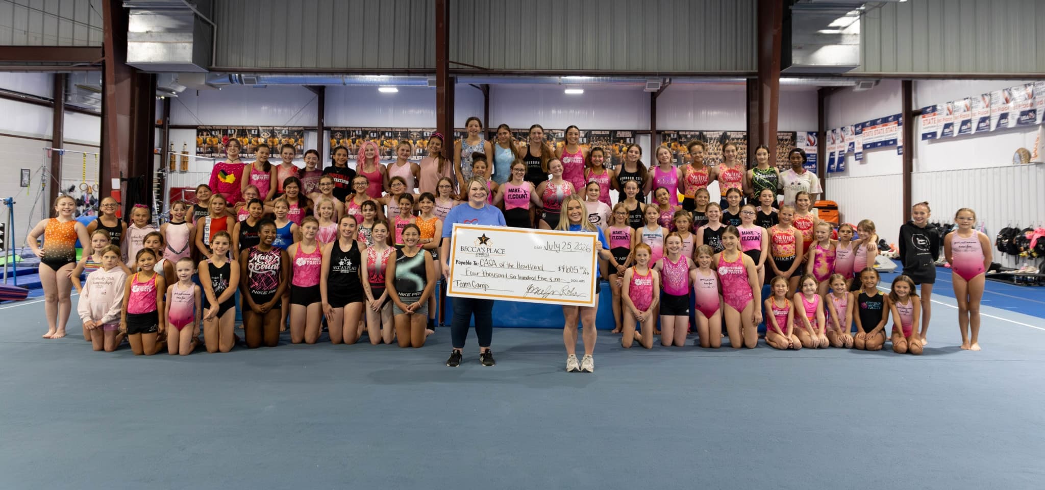 Becca's Place gymnasts and coaches together on the gym floor